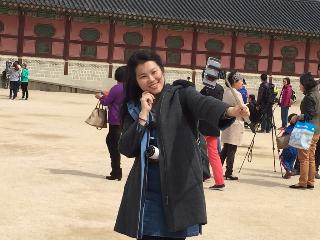 Gyeongbokgung Palace. A tourist with a selfie stick.