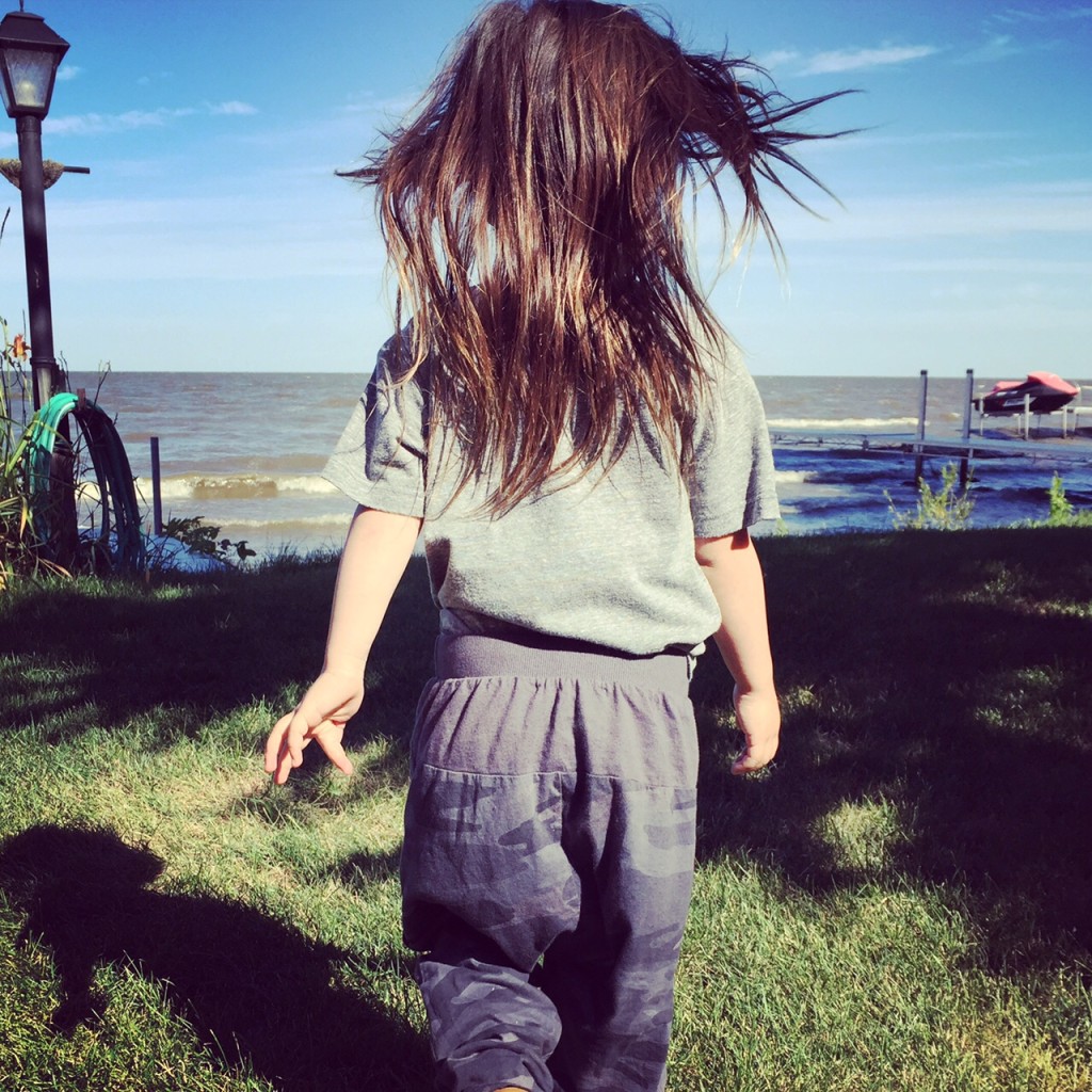 child walking near the beach