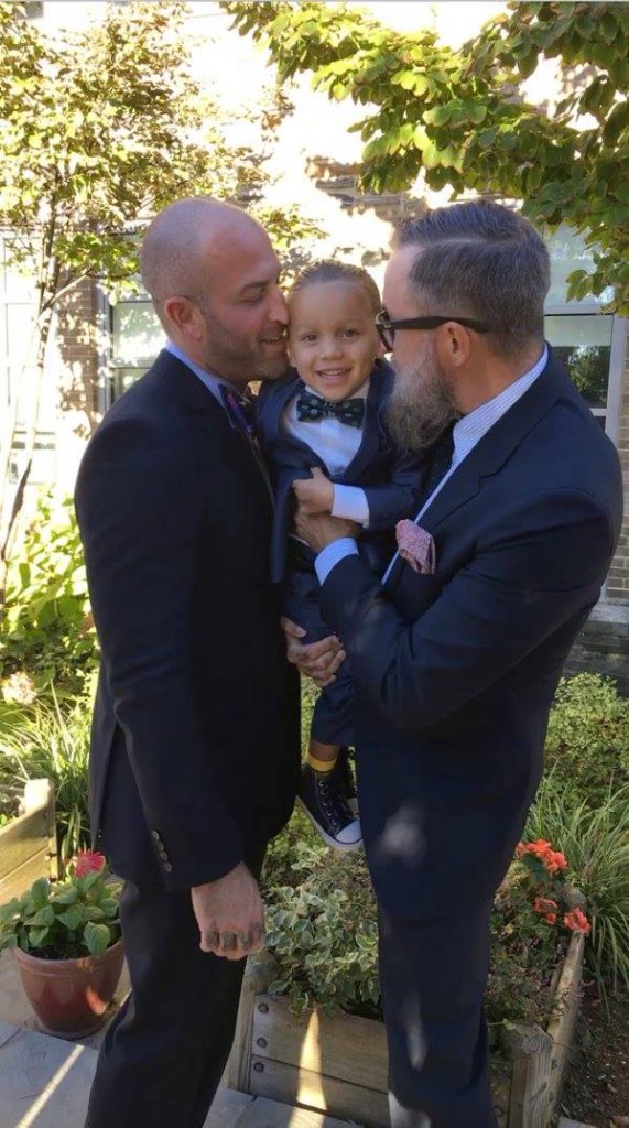 same-sex couple with their adopted child