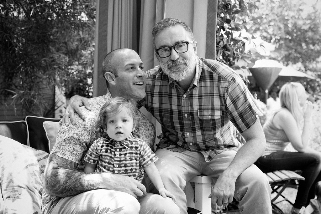 same-sex couple with the child they adopted 