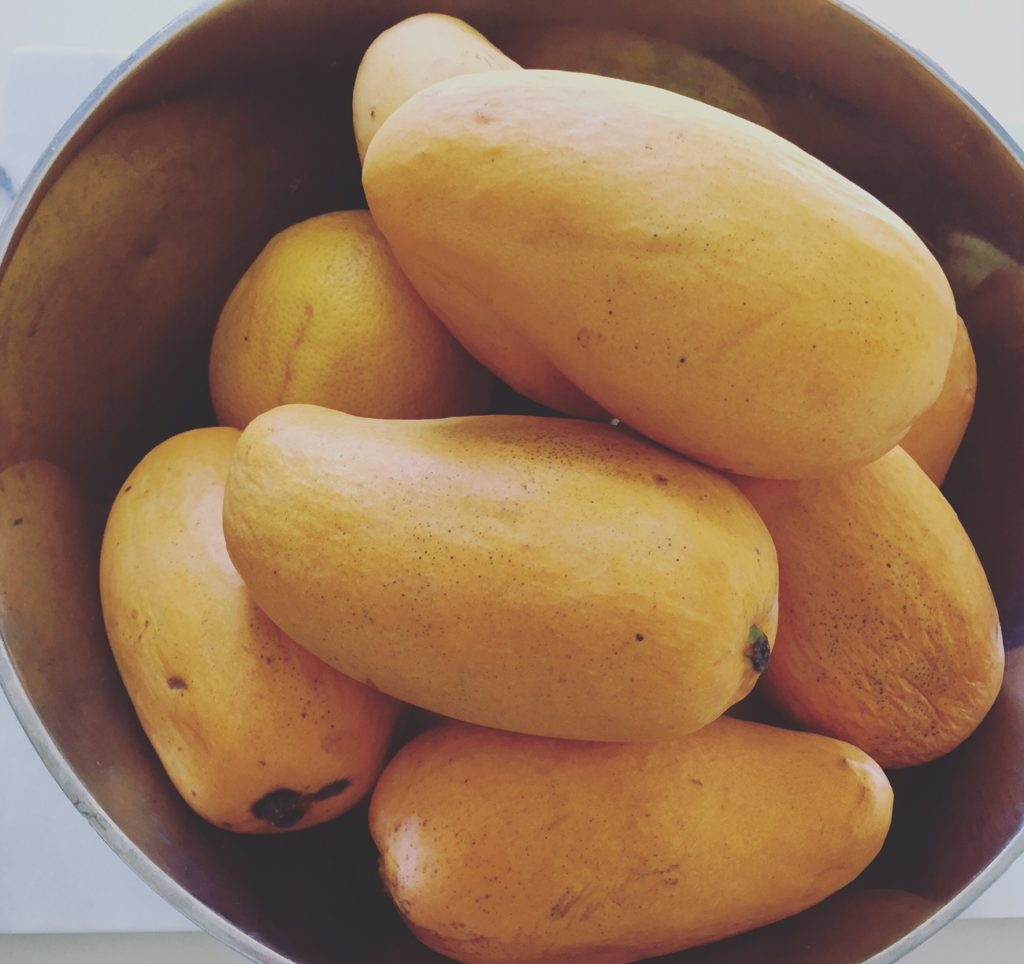 ripe mango on a bowl