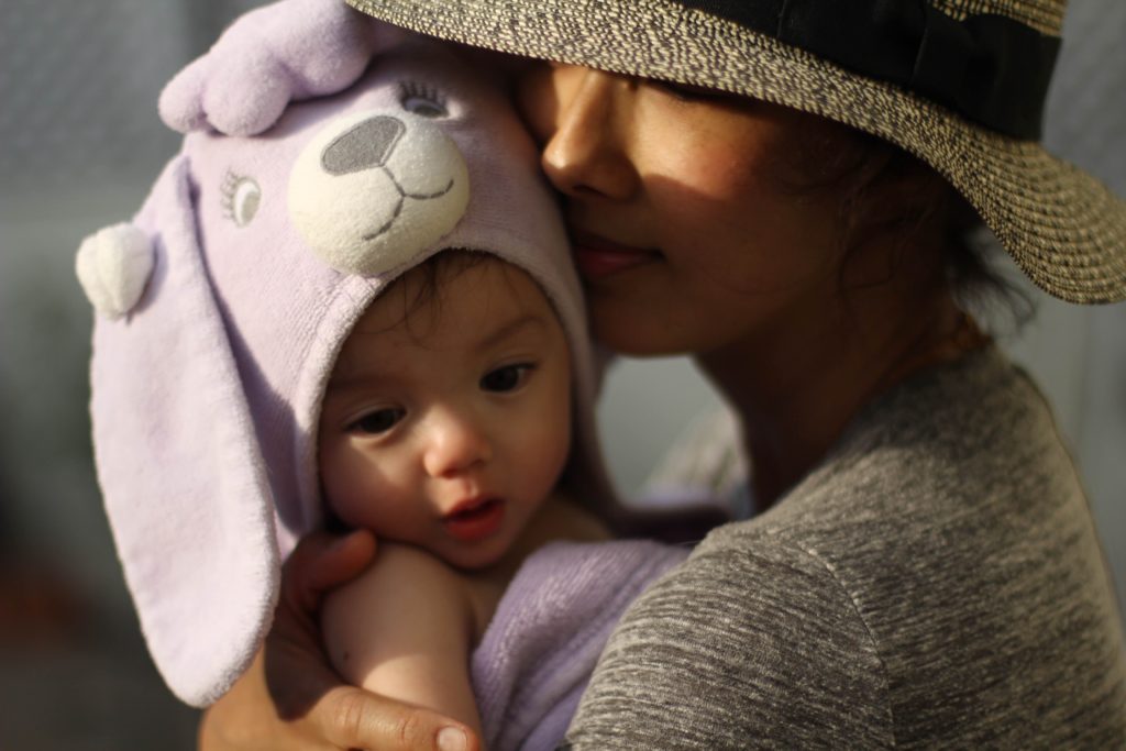 Maurissa Tancharoen Whedon with her child