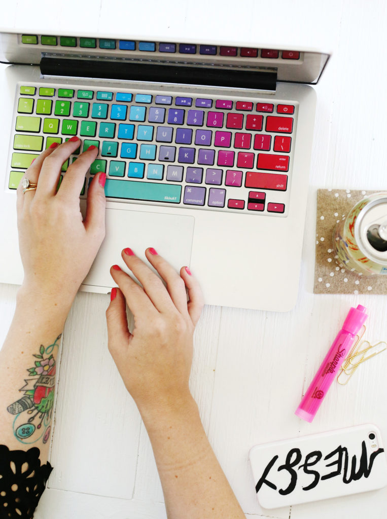 top view of woman's hands working on a laptop BEST LIFESTYLE BLOGS