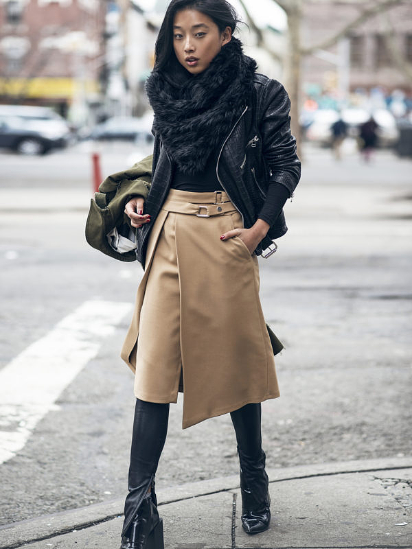woman wearing skirt, boots, and leather jacket for BEST LIFESTYLE BLOGS 