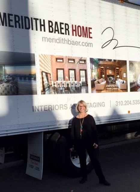 BONNIE BRUCKHEIMER standing near a  truck 