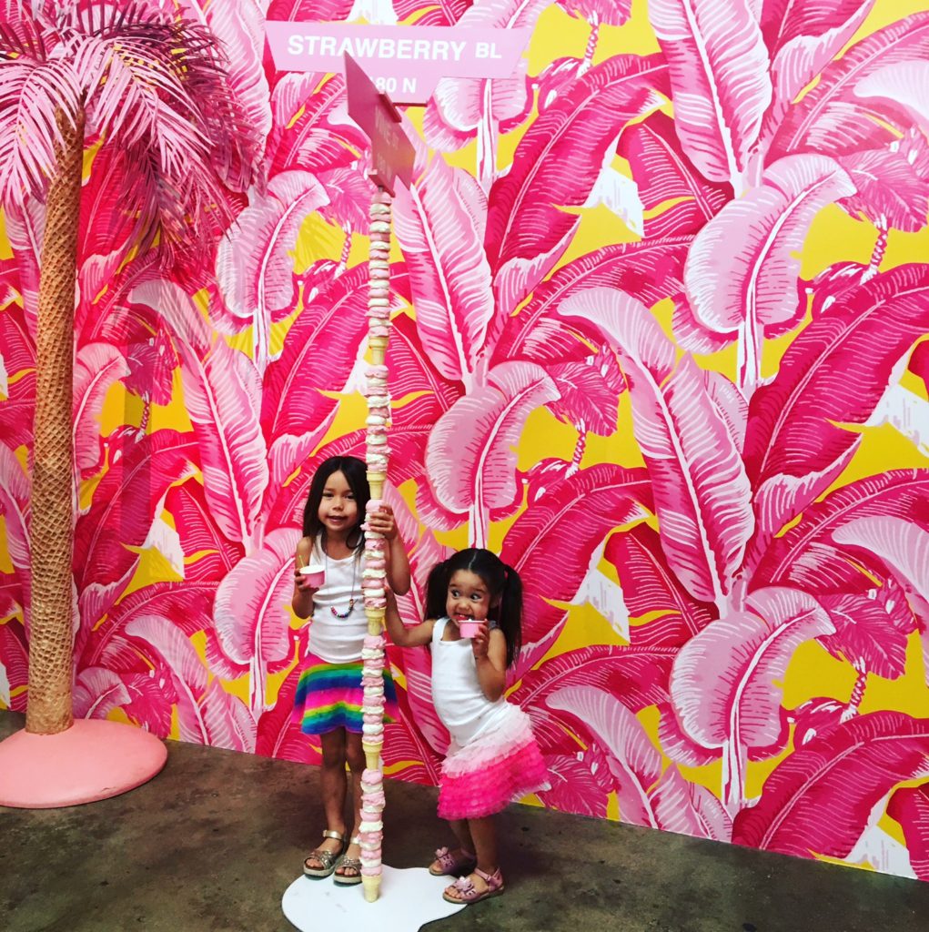 two kids playing with ice cream tower in MUSEUM OF ICE CREAM