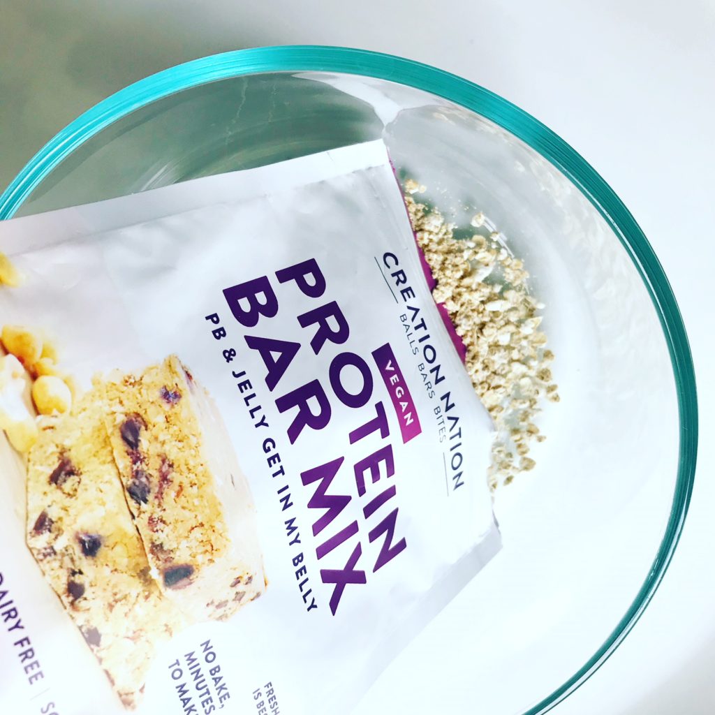 CREATION NATION PROTEIN BAR MIX poured in a bowl 