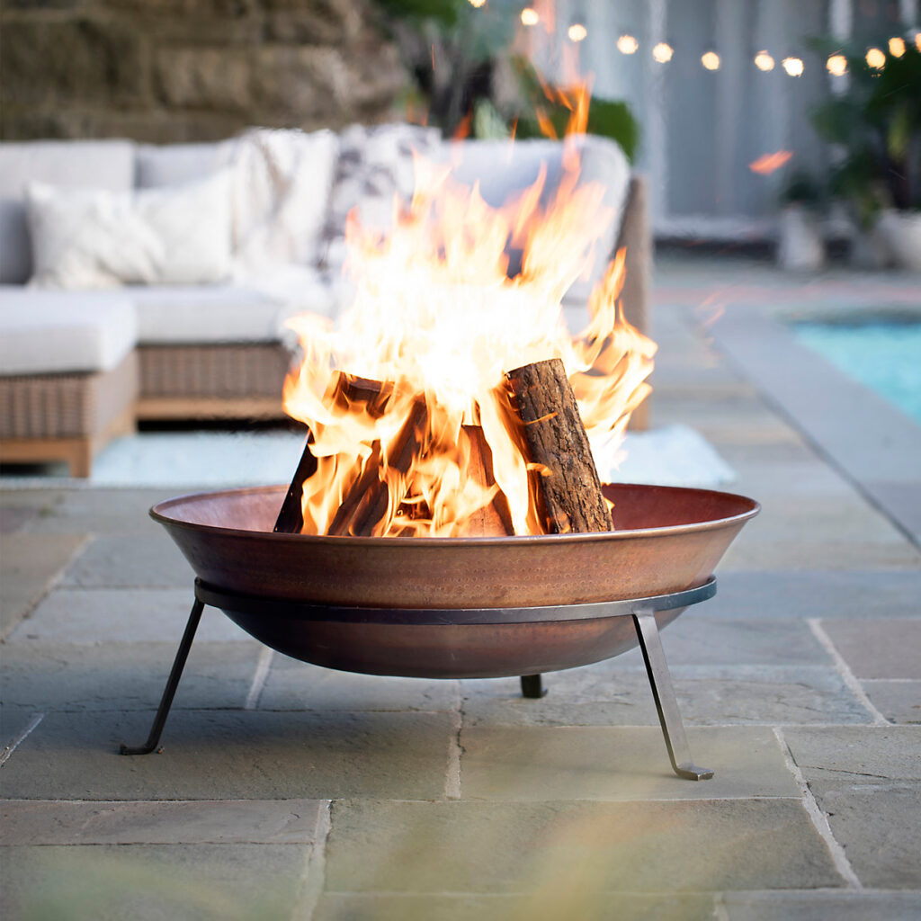 coper fire pit on the poolside for FATHER'S DAY GIFT GUIDE 2021